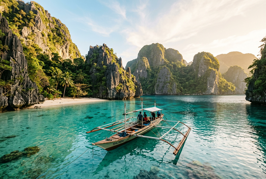 A bangka boat on a turquoise lagoon between limestone cliffs in the Philippines